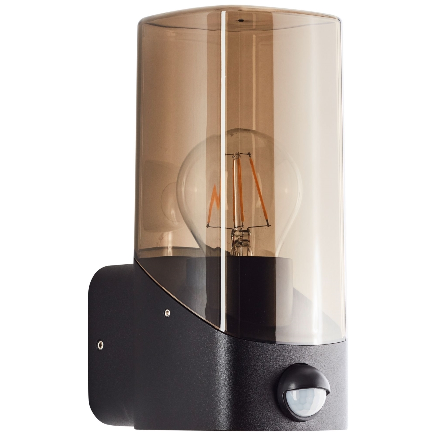 Brilliant - Φωτιστικό τοίχου εξωτερικού χώρου με αισθητήρα MINOU 1xE27/10W/230V IP44 μαύρο/φιμέ