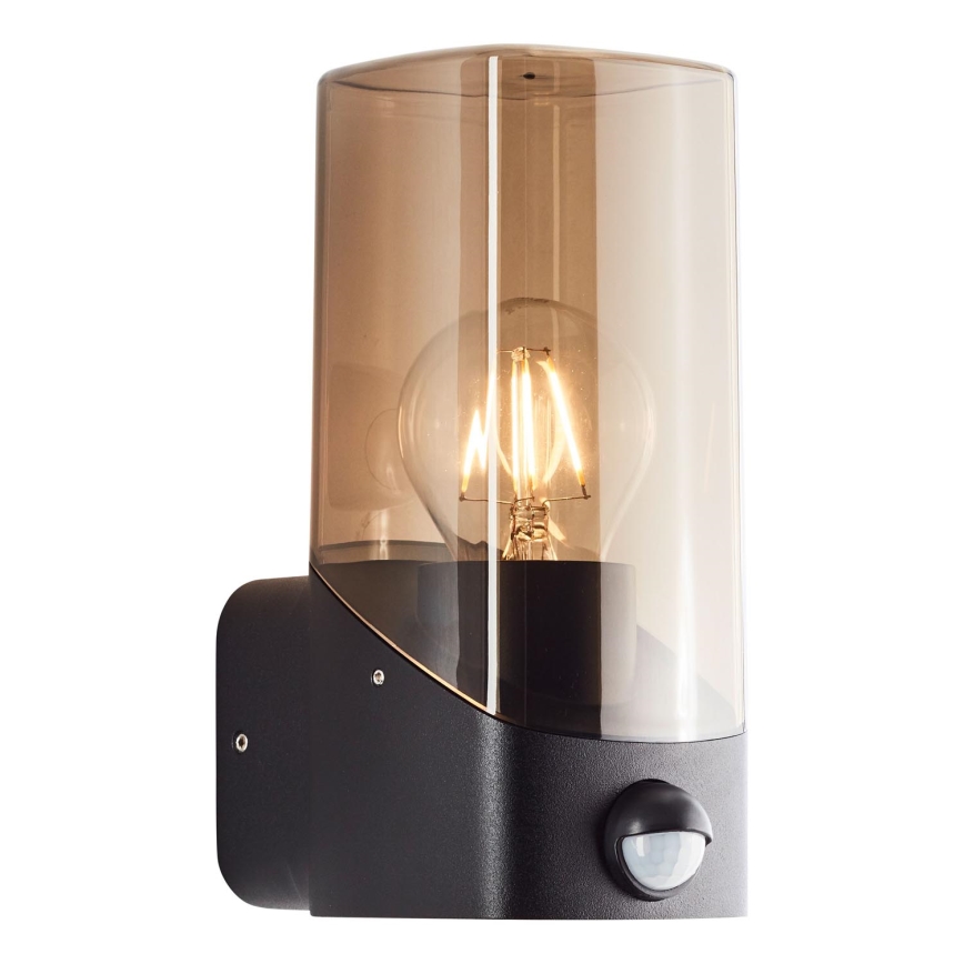 Brilliant - Φωτιστικό τοίχου εξωτερικού χώρου με αισθητήρα MINOU 1xE27/10W/230V IP44 μαύρο/φιμέ