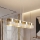 Κρεμαστό φωτιστικό σε καλώδιο LUX 4xE27/15W/230V λευκό/χρυσό