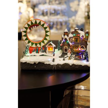 LED RGB Χριστουγεννιάτικο φωτιζόμενο διακοσμητικό με μουσική 30xLED/1,5W/230V χιονισμένο χωριό