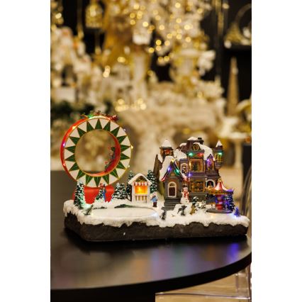 LED RGB Χριστουγεννιάτικο φωτιζόμενο διακοσμητικό με μουσική 30xLED/1,5W/230V χιονισμένο χωριό