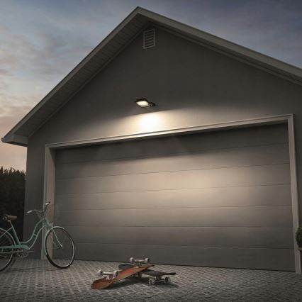 Προβολέας LED εξωτερικού χώρου με αισθητήρα κίνησης και φωτός (σούρουπο) LED/100W/230V 4500K IP65 μαύρος