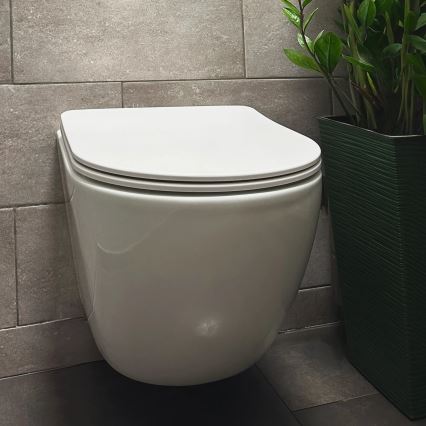 REA-C1259 - Κρεμαστή λεκάνη WC με κάθισμα CARLO MINI TORNADO RIMLESS, κεραμική/γυαλιστερό λευκό